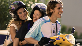 Young Millionaires TV show screenshot 2: Jess and Samia ride with David on yellow scooter.