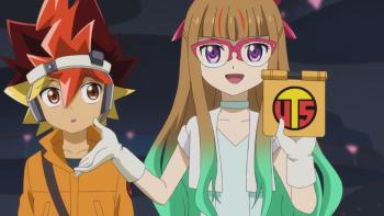 Yu-Gi-Oh! Go Rush!! TV: Yuhi looks confused at Yuamu as she holds up her UTS badge to the camera.