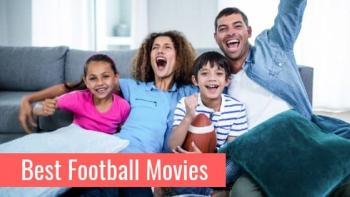 Family together on couch cheering and holding football