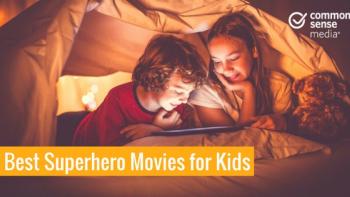 Young white girl and boy sit under a blanket fort, reading a comic book.