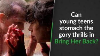 Laura (Sally Hawkins), leaning against a window with bloody hands with Oliver (Jonah Wren Phillips) on the other side of the window