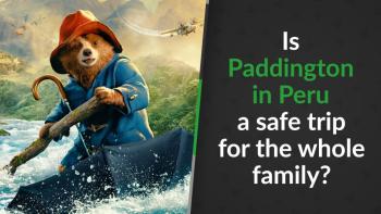 Paddington using his umbrella as a boat