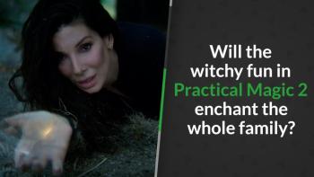 A woman lies on grass, her palm glowing