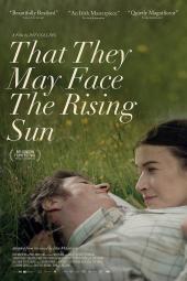 They May Face the Rising Sun movie poster: A White man and woman lay in the grass looking into each other's eyes