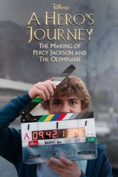 A Hero's Journey: The Making of Percy Jackson and the Olympians TV Show: actor playing Percy peeks out behind a movie slate