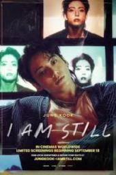 Jung Kook: I Am Still TV show poster: BTS member Jung Kook in front of a screen with his images displayed