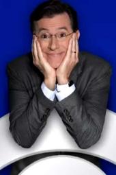 The Late Show with Stephen Colbert TV poster: Colbert with head in his hands smiling, leaning on top of CBS logo