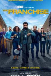 The Franchise TV show poster: The Maximum Studios crew lines up on set under a clear blue sky; Daniel is in front with a megaphone 