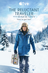 The Reluctant Traveler TV show poster: Eugene Levy walks with blue winter coat and suitcase in snow. 