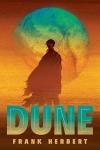 Dune book cover: Silhouette of a person in the desert with a planet behind them and the book title below