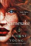 Namesake book cover: A close-up of half the face of a woman with red hair reveals one blue eye sparkling like a gem and two long green gems set in gold dangling from one ear