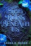 Correct: The Ruins Beneath Us book cover: Blue and black with blue flowers and filigree