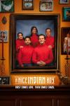 A Nice Indian Boy Movie Poster: Characters sit for a family portrait wearing matching red turtlenecks