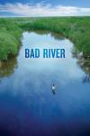 Bad River movie poster: Two Bad River Band Native people canoe down the bad river with green trees on either side and blue sky above them