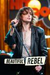 Beautiful Rebel movie poster: Italian white woman in black leather jacket holds microphone stand and microphone on stage