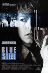 Blue Steel movie poster: Jamie Lee Curtis holds a gun in the air against a city backdrop