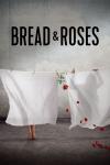 Bread & Roses movie poster: Against sky blue wall with clouds, Afghan women clothespin two sheets to a line but only one (left) has feet showing