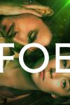 Foe movie poster: A close-up of Paul Mescal and Saoirse Ronan as married couple Junior and Hen, lying next to each other. 