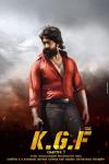 K.G.F -- Chapter 1: The film's hero, a bearded Indian man stands with his red shirt slightly unbuttoned