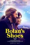 Bolan's Shoes movie poster: A bearded man and a woman with a sea town background