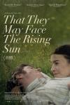 They May Face the Rising Sun movie poster: A White man and woman lay in the grass looking into each other's eyes