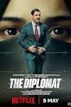 The Diplomat movie poster: A suited man with a serious expression in front of a veiled woman's eyes and barbed wire