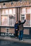 The Old Oak movie poster: Ebla Mari looks on smiling as Dave Turner adjusts a letter on the sign outside his pub