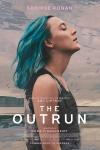 The Outrun movie poster: Saoirse Ronan stands on a beach facing up to the sky with her eyes closed and her hair blue