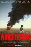 The Piano Lesson movie poster: John David Washington is in a field with a piano on fire