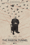 The Pigeon Tunnel movie poster: John le Carré, the White British author who is the subject of the film, is seated in a chair facing the camera with his hands and legs crossed, the gray-haired writer wearing a light-colored shirt and tie, dark-colored overcoat, pants, socks, and shoes, and there are images of pigeons flying above his head, against a beige and red graphic background where the film's title and other credits appear in black letters