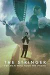 The Stringer: The Man Who Took the Photo movie poster: Vietnamese man holds camera in both hands on street, photographic layers of people fill sky