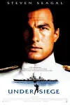 Under Siege movie poster: A stern-looking White man in navy uniform and a battleship beneath him