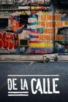 De La Calle TV Poster: A boombox sits on the ground. Graffiti’d wall on the background that reads “Go Inside the Urbano Music Revolution.”