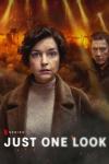 Netflix Just One Look. Brunette woman in brown coat and soiled face looks at camera with man and fire flames behind her.