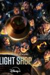 Light Shop TV show poster: a group of men and women standing close together, shot from above, with light fixtures shining down onto their faces