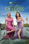 Luanne & Sonja: Welcome to Crappie Lake TV show poster: Sonja and LeAnn in pink and lavender evening dresses wading in water.  