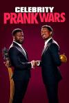 Celebrity Prank Wars TV show: Kevin Hart and Nick Cannon wear suits and shake hands while hiding a hose and a water balloon behind their backs. 