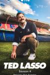 Ted Lasso Season 4: Ted Lasso squats down on the green grass of a football pitch, looking up to the sky beatifically and wearing a manager's uniform