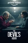 The Devil's Hour TV show poster: A man and woman sit at a table, facing each other. The woman has a concerned expression on her face. The man wears a 
