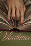 Vladimir TV show poster: A woman's hand with long red nails digs into the spine of an open book
